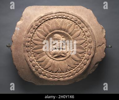 Double-Faced Crossbar from a Railing, c. 150 BC. India, Madhya Pradesh, Bharhut, Shunga Period. Plum-colored sandstone; overall: 55.9 x 66 cm (22 x 26 in.).  This lens-shaped section of a crossbar is from one of the the earliest known Buddhist monuments in India to be embellished with stone relief carvings. It is from a circular fence that surrounded a stupa and demarcated the sacred space from the outside world. Stock Photo