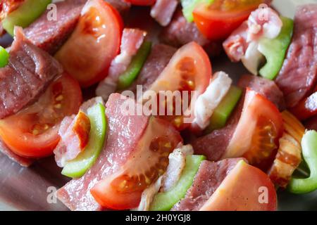 Beef and vegetables brochettes on a dish Stock Photo