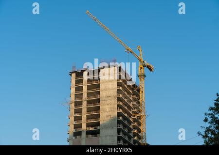 Part of a multi-storey building under construction lies in ruins ...