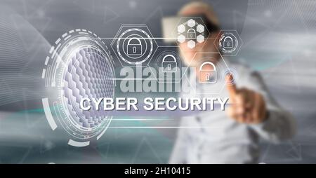 Man with vr headset touching a cyber security concept on a touch screen with his finger Stock Photo