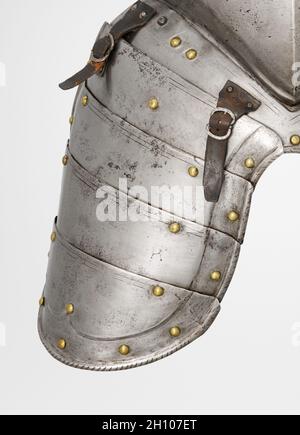 Tasset (proper right), c. 1560-1580. South Germany, 16th century. Steel, leather straps, brass rivets; overall: 28.2 x 22.3 cm (11 1/8 x 8 3/4 in.).  This armor was developed for the joust-a sporting combat between two mounted contestants. Although all of the elements of this armor date from the same period, they are not all from the same suit. This armor is thus called 'composed.' It also shows the asymmetry of jousting armor. The participants rode along a wall-like barrier known as a 'tilt' with their left sides facing one another. Consequently, armor on that side of the body had to be thick Stock Photo