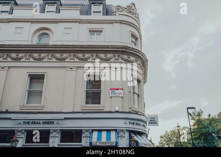 London, UK - October 09, 2021: Street name sign on a building in Bow Street in Covent Garden, an area of London famous for its bars, restaurants and c Stock Photo