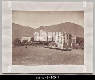 Untitled (Hong Kong, St. John’s Cathedral, from the Parade Ground, H.M. Regiment on Parade), 1866-73. Lai Fong (Afong Studio) (Chinese, c. 1839-1890). Albumen print; image: 20.1 x 26.7 cm (7 15/16 x 10 1/2 in.); paper: 20.1 x 26.7 cm (7 15/16 x 10 1/2 in.); mounted: 26 x 33.3 cm (10 1/4 x 13 1/8 in.).  Since the customers for landscape photographs were mostly Westerners, most Chinese studios focused on portraiture. Lai Fong, however, offered views of China, which set him in competition with European photographers who had monopolized that market. Here, soldiers from the Queen’s Regiment march o Stock Photo