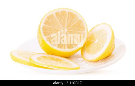 Sliced ​​lemon on a white platter isolated on white background. Clipping Path. Full depth of field. Stock Photo