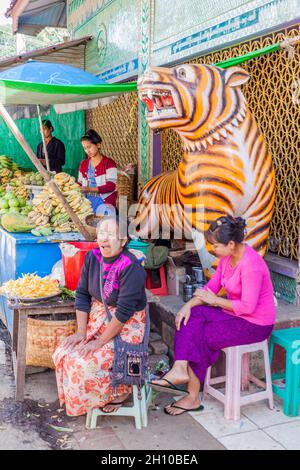 MT POPA, MYANMAR - DECEMBER 8, 2016: Local people near the entrance to Taung Kalat Monastery on Mt. Popa, Myanmar Stock Photo