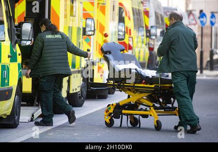 London, UK. 15th Oct, 2021. Queues of ambulances and a steady stream of arrivals at Whitechapel Hospital. Just under 38,000 new Covid cases were reported on October 14th. The NHS is under severe pressure with a big backlog of patients for routine operations. Credit: Mark Thomas/Alamy Live News Stock Photo