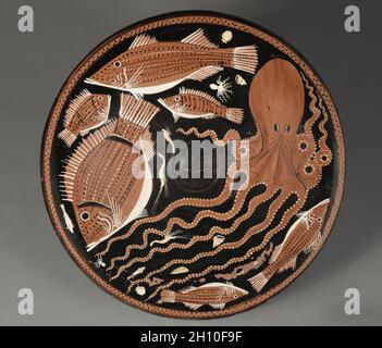 Red-Figure Fish Plate: Octopi, Mullet, Bream, Shellfish, c. 340–330 BC. Attributed to Asteas/Python Workshop (South Italian, Paestan, active c. 360-320 BC). Ceramic; diameter: 38.3 cm (15 1/16 in.); overall: 7.9 cm (3 1/8 in.); diameter of foot: 16 cm (6 5/16 in.). Stock Photo