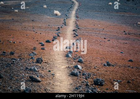 hiking path, dirt trail or walkway in desert landscape - Teide National Park in Tenerife Stock Photo