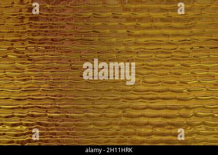Wavy surface in beige, gold and brown. Interesting background or texture for further work Stock Photo