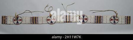 Blanket Strip, c. 1900. America, Native North American, Plains, Tistsistas (Cheyenne) people, Post-Contact. Native-tanned hide, glass beads, yellow trade cloth, brass beads, sinew thread ; overall: 188 x 10.8 cm (74 x 4 1/4 in.). Stock Photo