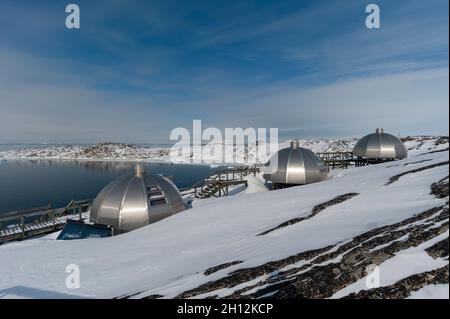 Aluminium igloos at the Hotel Arctic In Ilulissat with a view on Disko Bay. Disko Bay, Ilulissat, Greenland. Stock Photo