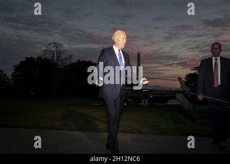 Washington DC, USA. 15th Oct, 2021. President Joe Biden speaks to reporters as he arrives on the South Lawn of the White House in Washington, DC, on Friday, October 15, 2021. Biden returned from a trip to Connecticut. Photo by Oliver Contreras/UPI Credit: UPI/Alamy Live News Stock Photo