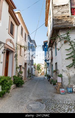 Ayvalik, Turkey - September 2021: Ayvalik old street view with historical buildings and architecture style. Ayvalık is a popular seaside in Turkey Stock Photo