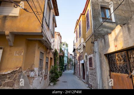 Ayvalik, Turkey - September 2021: Ayvalik old street view with historical buildings and architecture style. Ayvalık is a popular seaside in Turkey Stock Photo