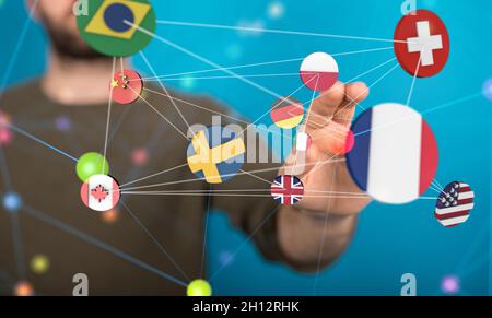 Man tapping floating 3D rendered flag icons Stock Photo