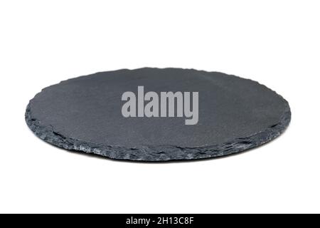 Natural black stone slate as a tray. Side view of slate board isolated on white Stock Photo