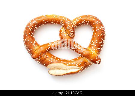 Natural handmade pretzel isolated on white. Traditional Bavarian pretzel for Oktoberfest and as snack for beer, top view Stock Photo