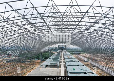 (211016) -- QIAN'AN, Oct. 16, 2021 (Xinhua) -- Aerial photo taken on Sept. 16, 2021 shows the construction site of a 'road-to-rail' project in Qian'an Ctiy, north China's Hebei Province. Qian'an in Hebei Province is a major county in steelmaking industry in north China, with a large transportation demand for raw materials such as iron ore, coal and coke. In order to reduce pollution and traffic congestion caused by road transportation of bulk goods, special railway lines for key iron and steel enterprises have been built under a 'road-to-rail' scheme, which paved the way for a greener and Stock Photo