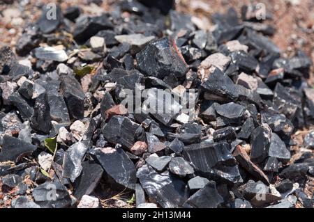 Small chunks of black obsidian glass. Armenia Stock Photo