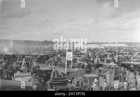 A vintage 1925 black and white photograph showing an air display at RAF Northolt near London, England. A large crowd watches the display. Stock Photo