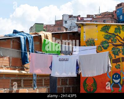 Medellin, Antioquia, Colombia - December 23 2020: Children's Clothes Hanging and Drying of the Sun over in a Rope Stock Photo