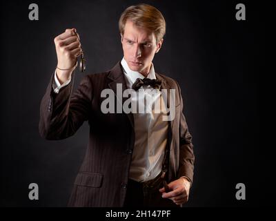 Man in Vintage Suit and Leather Gloves Holding Pocket Watch. Concept of  Classic and Eccentric British Gentleman 17215464 Stock Photo at Vecteezy