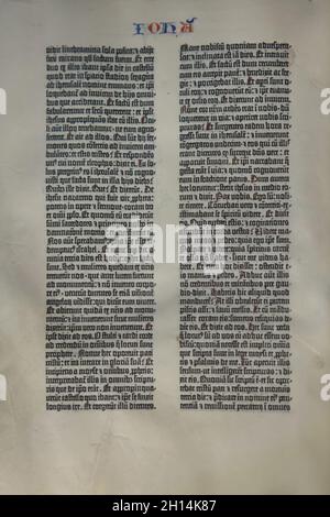 One of the pages of the Gutenberg Bible, also known as the 42-line Bible printed on vellum by German medieval printer and publisher Johannes Gutenberg in 1454-1455, now owned by the Staatsbibliothek zu Berlin (Berlin State Library) on display at the exhibition 'Late Gothic' in the Berliner Gemäldegalerie (Berlin Picture Gallery) in Berlin, Germany. Stock Photo