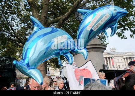 Trafalgar Square, London, UK. 16th Oct 2021. People protest against the killing of whales and dolphins in the Faroe Isles and Taiji in Japan. Credit: Matthew Chattle/Alamy Live News