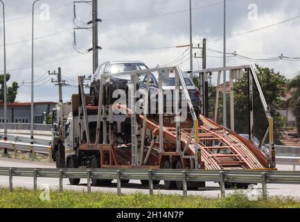 Chiangmai, Thailand - September 26 2021: NYK Logistic Carrier trailer Truck for Car Transport. On Urban road. Stock Photo