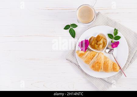 Breakfast - croissant, jam and coffee. Top view, flat lay Stock Photo
