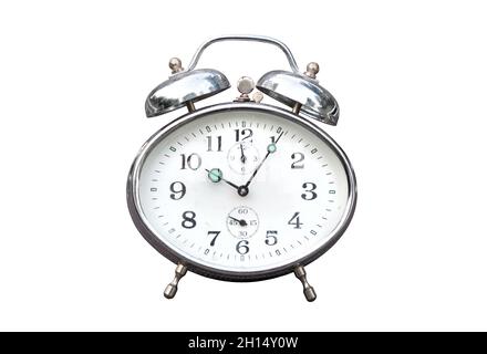 Old vintage alarm clock isolated on white background, front view closeup Stock Photo