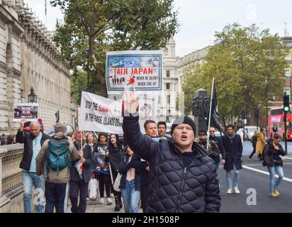 London, UK. 16th October 2021. Protesters in Whitehall. Sea Shepherd and other activists marched through Westminster, calling for an end to the slaughter of dolphins in Faroe Islands and Taiji, Japan. Credit: Vuk Valcic / Alamy Live News Stock Photo
