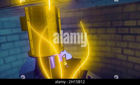 Abstract animation of golden neon lights going through the mechanism. Industry and manufacturing