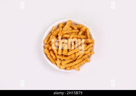 SNACKS STICKS CORN, isolated Image kurkure or namkeen sticks, background image. Stock Photo
