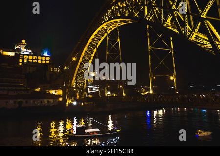 Watercolor drawing of Bridge Ponti Di Don Luis, lights of night city, night view of The Eiffel Bridge, Ponte Dom Luis, Boat floats under the bridge at Stock Photo