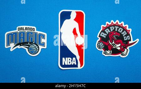 October 1, 2021, Springfield, USA, Emblems of the Toronto Raptors and Orlando Magic basketball teams on a blue background. Stock Photo