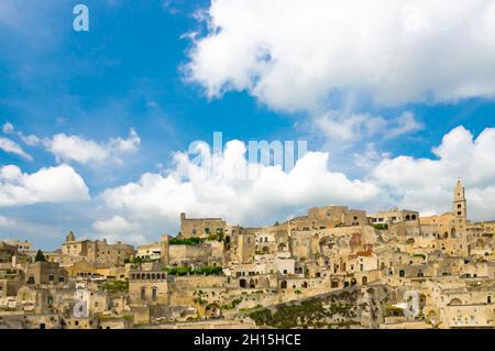 Watercolor drawing of Sassi di Matera panoramic view of historical centre Sasso Caveoso of old ancient town with rock cave houses in front of blue sky Stock Photo