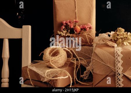 Eco friendly gift wrapping, zero waste materials and decoration, presents boxes still life on table. Stock Photo