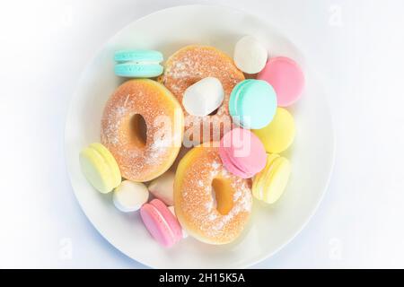 Different sweets isolated on white background, Doughnuts, macarons top view, unhealthy and candy concept Stock Photo