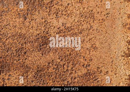 The old metal surface is corroded by rust under the influence of time and the environment. Texture, background. Stock Photo