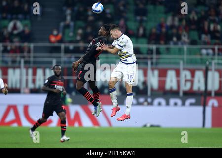 Milano, Italy. 16th Oct, 2021. Rafael Leao of Ac Milan and Nicolo Casale of Hellas Verona Fc battle for the ball during the Serie A match between Ac Milan and Hellas Verona Fc at Stadio Giuseppe Meazza on October 16, 2021 in Milan, Italy. Credit: Marco Canoniero/Alamy Live News Stock Photo