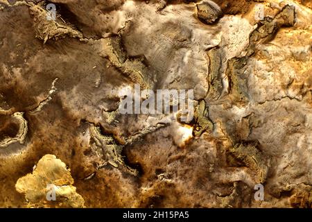 Close-up photo texture of copper or bronze statue material with folds. Stock Photo