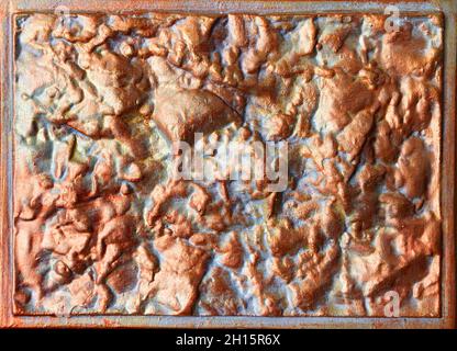 Close-up texture photo of bronze colored concete wall tile with border. Stock Photo