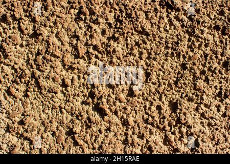 Photo texture of brown colored concrete wall stucco. Stock Photo