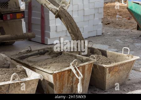 Cement mortar in construction tanks. Cement mortar for brickwork Stock Photo