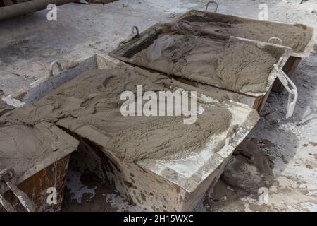 Cement mortar in construction tanks. Cement mortar for brickwork Stock Photo