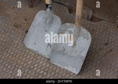 Close-up on two construction shovels. Construction tool. Stock Photo