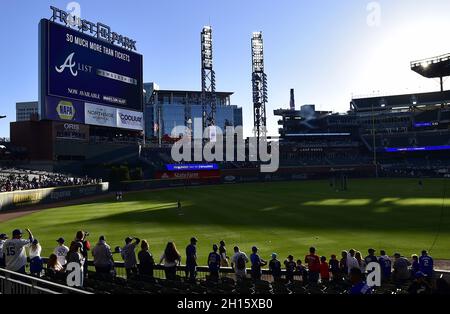 Atlanta, United States. 16th Oct, 2021. Baseball fans line the field as the sun sets during warmups before the Los Angeles Dodgers and Atlanta Braves in game one of the MLB NLCS at Truist Park on October 16, 2021, in Atlanta, Georgia. Photo by David Tulis/UPI Credit: UPI/Alamy Live News Stock Photo