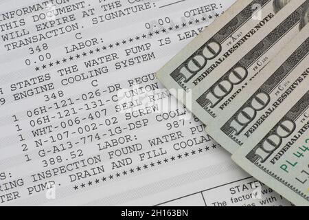 Lake Elsinore, CA, USA - October 15, 2021: Currency on auto repair bill. Stock Photo