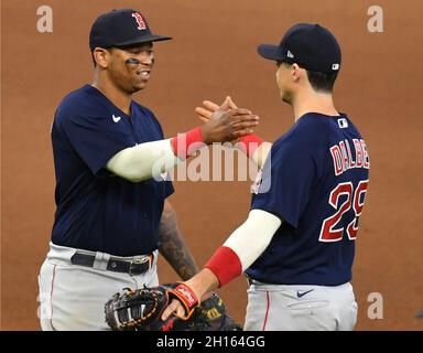 Boston Red Sox Bobby Dalbec is greeted by Niko Goodrum (23) as he scores on  an RBI single by Reese McGuire in the second inning of a spring training  baseball game against